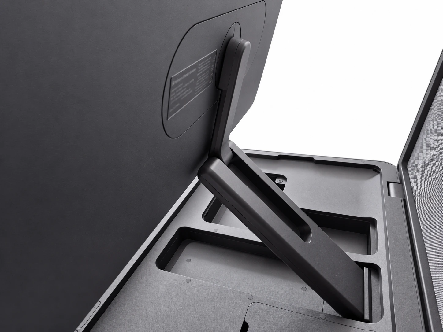 Close-up of the AX-Core screen stand and the storage compartments in the base